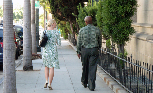 A man and woman walking at 